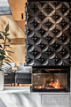 a modern fireplace in the middle of a living room