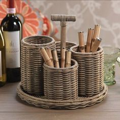 a wicker basket with wine bottles and corks