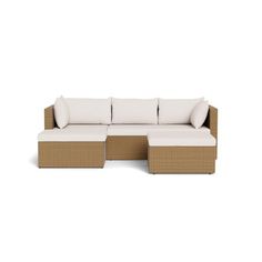 an outdoor sectional sofa with white cushions and pillows on the bottom, in front of a white background