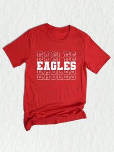 a red t - shirt with the word eagles printed on it