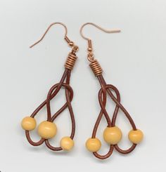 These lightweight fun earrings are approximately 2" long and 1" wide. Copper ear wires. Copper Components are Sealed with Protectaclear ProtectaClear is a clear, protective coating that is tough enough to protect jewelry and is safe for wear against skin. ProtectaClear is practically invisible once applied and will seal and protect jewelry from tarnish, oxidation, and corrosion Copper Wire Drop Earrings With Matching Set, Adjustable Dangle Chandelier Earrings, Adjustable Copper Wire Pierced Earrings, Adjustable Teardrop Wire Jewelry, Adjustable Teardrop Linear Earrings With Ear Wire, Adjustable Drop Wrap Earrings, Unique Hypoallergenic Adjustable Earrings, Adjustable Wire Wrapped Brown Earrings, Adjustable Brown Wire Wrapped Earrings