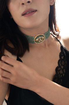 Indulge in elegance with this captivating choker necklace, adorned with exquisite details that set it apart as a unique accessory. Its central focal point showcases an oval jade stone, emitting a soothing mint green hue that exudes tranquility and freshness. The intricate Hauldili work adds delicate patterns and fine detailing, creating a visually appealing contrast against the cool mint green backdrop. Finish: 22KT Gold Plating Material: Silver, Copper Alloy, Onyx, Kundan & Pearl Color: Green S Delicate Choker Necklace, Green Choker, Hand Jewelry Rings, Chain Braid, Green Backdrops, Fancy Jewelry, Jade Stone, Hand Jewelry, Anklet Jewelry