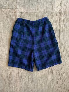 Vintage blue and green plaid thin corduroy shorts from the 1950's, with a side zip, super soft and comfortable. No flaws to note. Fits best a 24" waist. Measured flat: Waist 12" Rise 13.5" Hips 18.5" Inseam 6.5" PLEASE READ! *MEASUREMENTS* All items are measured while laying flat and unstretched. For clothing: chest, waist, hip and thigh measurements should be multiplied by two. All measurements are in inches. *VINTAGE CONDITION* Vintage goods may show signs of wear and age. We always indicate and/or show in pictures any major flaws or blemishes, but will not always mention small flaws, such as pinpoint sized spots or holes. If you are concerned about a particular item's condition, please message us. All of our pieces are pre-owned. We use a natural detergent to wash all our textiles when Plaid Boxers, Natural Detergent, Green Tartan, Corduroy Shorts, High Waist Shorts, Plaid Shorts, Boxer Shorts, Green Plaid, Tartan Plaid