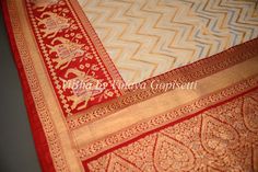 Experience the luxurious feel of our Butter Cream and Dark Red Banarasi Katan Silk Saree. Its intricate patola borders and pallu add a touch of elegance. Made from high-quality silk. Elevate your wardrobe with its timeless piece. The accompanying saree blouse is tailored and embellished with embroidered neckline and also back with handcrafted dori and tassels. The attention to detail further enhances it and gives the blouse a great finish. Designer Red Saree With Embroidered Border, Elegant Red Saree With Border, Red Anarkali Traditional Wear With Border, Red Silk Traditional Wear With Border, Elegant Red Saree With Embroidered Border, Elegant Red Traditional Wear With Border, Red Paithani Silk Dupatta With Border, Banarasi Katan Silk Saree, Katan Saree