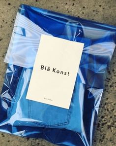 a blue bag with the word bla konst on it sitting on top of a floor