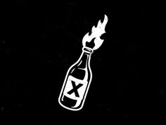 a bottle with the letter x in it on fire