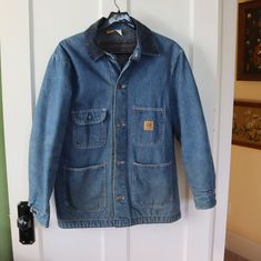 Vintage  Big Ben by Wrangler Denim Work Jacket - Made in USA and worn and authentically distressed by a Kentucky farmer.  Four front pockets on front (one breast pocket has a snap closure), blue corduroy collar, button front, 100% cotton denim with a blue striped blanket-style lining. Clean (freshly laundered) and shows wear; one small hole in the lining (see last photo). Tag size 40 -  Measures 22 inches laying flat from armpit to armpit (44 inches total); 28 inches long. Measured laying flat s Rugged Long Sleeve Denim Jacket With Pockets, Dark Wash Rugged Outerwear With Pockets, Rugged Denim Outerwear With Pockets, Rugged Dark Wash Outerwear With Pockets, Rugged Denim Jacket With Pockets, Rugged Denim Jacket With Pockets For Fall, Utility Denim Outerwear Pre-washed, Utility Denim Outerwear, Pre-washed Denim Utility Outerwear