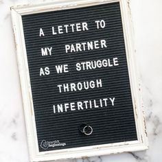 a sign that says, a letter to my partner as we struggle through inferitity