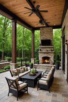 an outdoor living area with furniture and a fireplace