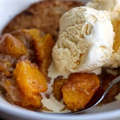 a bowl filled with ice cream and fruit