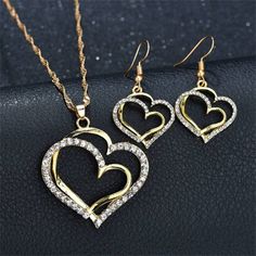 Luxury Double Heart Jewelry Set For Women Wedding Gold Jewelry Jewelry Sets Type: Necklace/Earrings Brand Name: Genuine-Gemstone Occasion: Party Item Type: Jewelry Sets Package: Necklace/Earrings Metals Type: 14k gold plated Style: Cute/Romantic Material: Rhinestone Shape\pattern: Heart Gender: Women Brand Name : Genuine-Gemstone Heart Jewelry Set, Double Heart Necklace, Heart Shaped Jewelry, Gold Wedding Jewelry, Heart Shaped Necklace, Retro Mode, Fashion Jewelry Sets, Double Heart, Geometric Jewelry