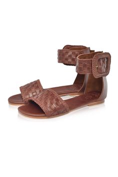 These leather sandals are made to order from high quality soft leather. Delight in the craftsmanship of these jaw dropping Madagascar leather sandals. Featuring woven leather upper with braided accents and large decorative leather bound buckle these sandals will keep you sleek and chic anywhere you go. Style them with your mini wrap dress to elevate your everyday casual look or with your floaty maxi skirt for a super chic style. -Smooth leather lining and insole with embossed logo -Lightly padde Bohemian Woven Leather Sandals For Beach, Bohemian Woven Leather Beach Sandals, Bohemian Brown Sandals With Ankle Strap, Bohemian Woven Leather Huarache Sandals For Vacation, Brown Bohemian Sandals With Ankle Strap, Bohemian Brown Ankle Strap Sandals, Braided Leather Ankle Strap Sandals, Festival Leather Sandals With Woven Sole, Bohemian Sandals With Ankle Strap And Leather Sole