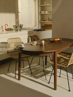 a table and chairs in a small room