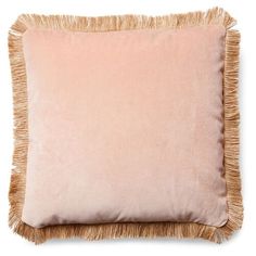 a pink pillow with tassels on the bottom and side, against a white background