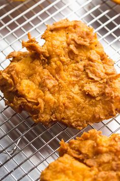 some fried food is cooling on a rack