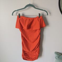 New Never Worn No Tags Super Cute Women's Bratop Strapless Ruched Dress With Ruffle Top This Dress Has A Built-In Bra Top And Ruched Sides For That Conforming Fit! Size: Extra Small Color: Bright Orange Flirty Ruched Tube Top For Beach, Summer Stretch Strapless Mini Dress, Summer Stretch Ruched Mini Dress, Summer Strapless Stretch Mini Dress, Strapless Stretch Summer Mini Dress, Summer Stretch Mini Dress With Ruched Details, Bandeau Mini Dress For Beach With Ruched Detail, Fitted Off-shoulder Tube Top For Brunch, Stretch Sleeveless Beachwear Tube Top