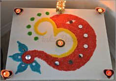 a decorated table with candles on it in the shape of a red and yellow circle