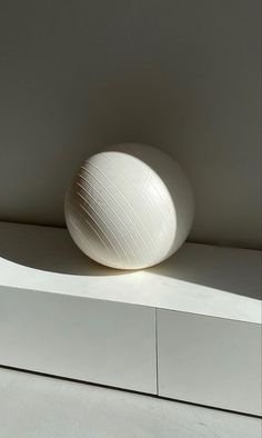 a large white ball sitting on top of a counter