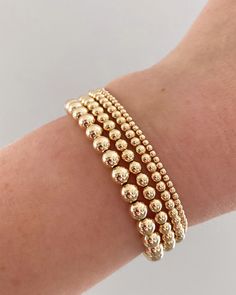 14k gold filled beaded stretch bracelet. Please measure your wrist and select your size in the dropdown as this bracelet is not one size fits all. SIZING TIP: To find out your bracelet size, wrap a piece of string around your wrist to measure (place it just above the wrist bone.) Then measure the length of the string. Then I'd recommend adding 0.8 inches (2cm) to that measurement to get your correct bracelet size. Gold Bracelet Preppy, Ball Bracelet Gold, Gold Beaded Bracelets, Simple Beaded Bracelets, Bracelet Business, Gold Bead Bracelet, College Class, Preppy Bracelets, Preppy Jewelry