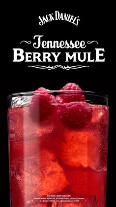 a close up of a drink in a glass on a black background with the title jack daniels'tennessee berry mule