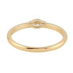 a yellow gold ring with a diamond on the top, and a small white diamond in the middle