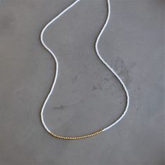 Our lithe necklace is handcrafted with a touch of gold in a minimalist style. •Seed beads hand strung in a minimalist pattern •Choose between blush or light blue •14kt Gold-Filled accents •16 inches in length or 16 inches with a 2 inch extender Minimalist Gold Beaded Necklaces With Tiny Beads, Minimalist Gold Beaded Necklaces For Everyday, Minimalist Gold Beads Necklace For Everyday, Minimalist Everyday Necklace With Gold Beads, Minimalist White 14k Gold Filled Necklace, Minimalist Gold Beaded Necklaces For Jewelry Making, White Necklaces With Tiny Beads For Everyday, Minimalist Gold Beads Necklace For Jewelry Making, Yellow Gold Beaded Necklaces For Everyday