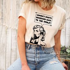 a woman wearing a t - shirt that says women's rights are represented by the 1950's