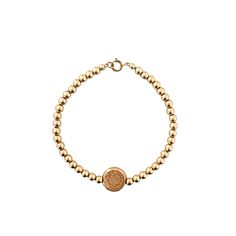 Beautiful and modern gold bead bracelet with a Saint Christopher charm. Carry around this symbol of protection for safe travels wherever you roam. Stack it with the Callan for an effortless, everyday look. All components are 14K gold filled, except for wire.  MATERIALS 14K Gold Filled If you love the look of gold, but don't want to spend as much as you would for solid gold pieces without losing out on quality, then gold filled is a great option for you. It is the second-best option after solid gold for high quality jewelry at a more affordable price. It is also far better than gold plated because a much thicker layer of gold is used, making it stronger and longer lasting. Adjustable Symbolic Gold Beaded Bracelets, Gold Symbolic Bracelets For Everyday, Everyday Symbolic Gold Bracelets, Gold Spiritual Charm Bracelet For Everyday, Spiritual Beaded Yellow Gold Bracelets, Symbolic Gold Beaded Jewelry, Spiritual Yellow Gold Beaded Jubilee Bracelets, Spiritual Yellow Gold Round Beads Bracelets, Spiritual Yellow Gold Beaded Jubilee Bracelet