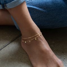 Dress up plain pumps or flats with this chic anklet featuring dangling polished discs on a layered chain. Thick layer of 14K Gold over .925 Sterling Silver 4mm Discs Hypoallergenic, lead, and nickel free Length: 9in (22cm) + Extension: 1in (2.5cm) Lobster clasp closure Handcrafted in NYC #ANK014 Anklet Designs, Anklet Bracelet, Jewelry Inspo, Dream Jewelry, Gold Vermeil, Handmade Bracelets, Anklets