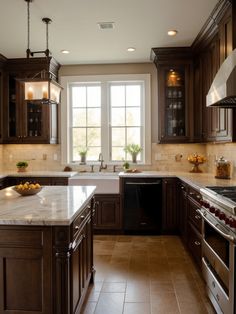 a large kitchen with wooden cabinets and marble counter tops, along with stainless steel appliances