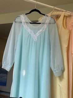 1960's Vintage baby-blue dressing gown, double layer nylon long sleeve dress with lace bodice and scoop neckline. Relaxed fit, A-line Excellent vintage condition 100% Nylon Fits bets Medium Large Measurements taken flat across in inches neck: 7" shoulders: 15" bust: 21" waist: 22" hip: 24" length: 52" Blue Sheer Sleep Dresses, Sheer Blue Sleep Dresses, Long Sleeve Blue Nightgown For Home, Light Blue Long Sleeve Nightgown For Spring, Blue Vintage Wedding Nightgown, Vintage Blue Wedding Nightgown, Vintage Blue Sheer Sleepwear, Blue Sheer Vintage Sleepwear, Long Sleeve Sheer Sleep Dress