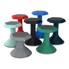 several different colored stools sitting next to each other