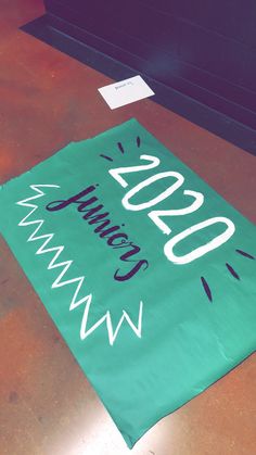 a green banner with the words summit on it sitting on top of a wooden table