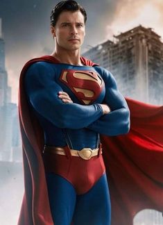 the man in superman costume is standing with his arms crossed