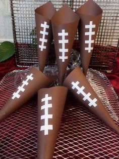 four football cones with white crosses on them