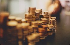 stacks of coins sitting on top of a table