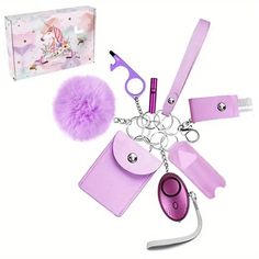 an assortment of accessories including a keychain, pen, scissors and pom - pom