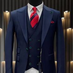 This Modern Fit Suit Features A Wide Peak Lapel, 1 Button Closures, Double Breasted Vest, Side Vents, And Matching Flat Front Pants. Blue Single-button Three-piece Suit For Office, Blue Wedding Suits With Buttons, Blue Office Suits With Double Button Closure, Elegant Blue Three-piece Suit With Buttons, Blue Single Button Office Sets, Classic Blue Suit With Double Button Closure, Navy Tailored Suit With Buttons, Classic Blue Suits With Double Button Closure, Elegant Blue Double Breasted Suit With Button Closure