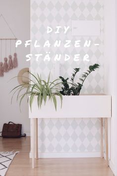 a white table with some plants on it and the words diy planten stander