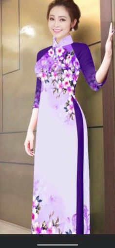 This high quality and very beautiful traditional Vietnamese ao dai that is suitable for all occasions.  It has a very beautiful floral prints that makes it look more elegant.  There is no return.  We offer free shipping.  Please feel free to contact us if you have any questions. Please note: These are Asian Sizes.  please kindly refer to the size chart when you place an order.  **All back order will arrive in 3 months.  But it usually arrive sooner. ** Other size are available as well.  4XL and 5XL Traditional Floral Print Formal Dress, Fitted Ao Dai With Floral Print For Spring, Traditional Purple Floral Print Dress, Floral Print Cheongsam For Spring Wedding, Spring Wedding Ao Dai With Floral Print, Elegant Fitted Purple Ao Dai, Traditional Ao Dai With Floral Print And Long Sleeves, Purple Long Sleeve Ao Dai For Spring, Traditional Ao Dai With Floral Print