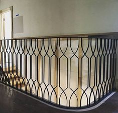 an iron railing in the middle of a room