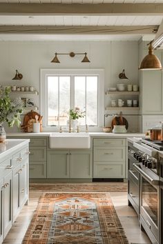 a kitchen with an area rug in front of the sink and stove top ovens