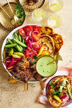 These chicken shawarma skewers are barbecued and served with a herby tahini sauce, haloumi flatbread and crisp vegetables. Chicken Pie Recipes, Chicken Thigh Fillet Recipes, Shawarma Platter, Middle Eastern Recipes Arabic Food, Meals For 4, Pesto Pasta Bake, Chicken Pies