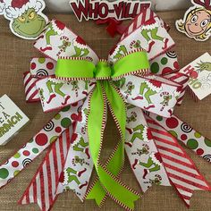 the grinch christmas bow is decorated with green and red ribbon