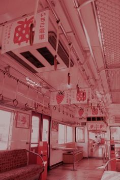 the inside of a train car with red and white decor