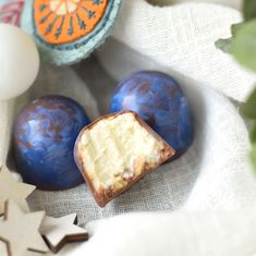 two pieces of cake sitting on top of a cloth next to some fruit and star decorations