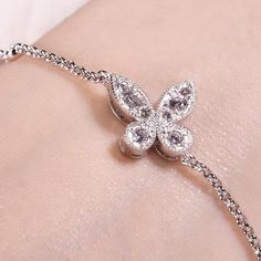 A smart choice you'll want to wear day after day, this sparkling bracelet speaks to your lovely sense of style. Crafted in sterling silver, it features a butterfly adorned with sparkling stones in varied sizes which wrapped in a frame of milgrain detailing.Besides,this bolo bracelet is easy to adjust the size to fit her wrist to create different looks. Sparkling stones add an element of glamour to this feminine design. This lovely bracelet make an elegant accessory. Weight: 4.67 gWidth: 14.97 mm Silver Sterling Silver Butterfly Bracelet, Butterfly-shaped Sterling Silver Bracelet, Sterling Silver Butterfly Bracelets, Elegant Butterfly Bracelets For Gifts, Elegant Butterfly Bracelets For Gift, Elegant Silver Butterfly Bracelets, Silver Bracelet With Butterfly Clasp, Elegant Silver Bracelet With Butterfly Charm, Silver Bracelet With Butterfly Clasp For Gift