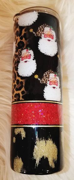 three different types of santa claus on black, gold and red glittered coffee mugs