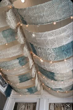 the ceiling is decorated with blue and white fabric