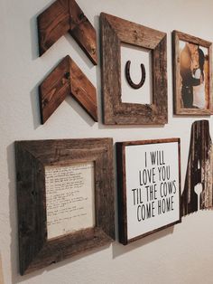 several framed pictures hang on the wall with wooden letters and photos attached to them,